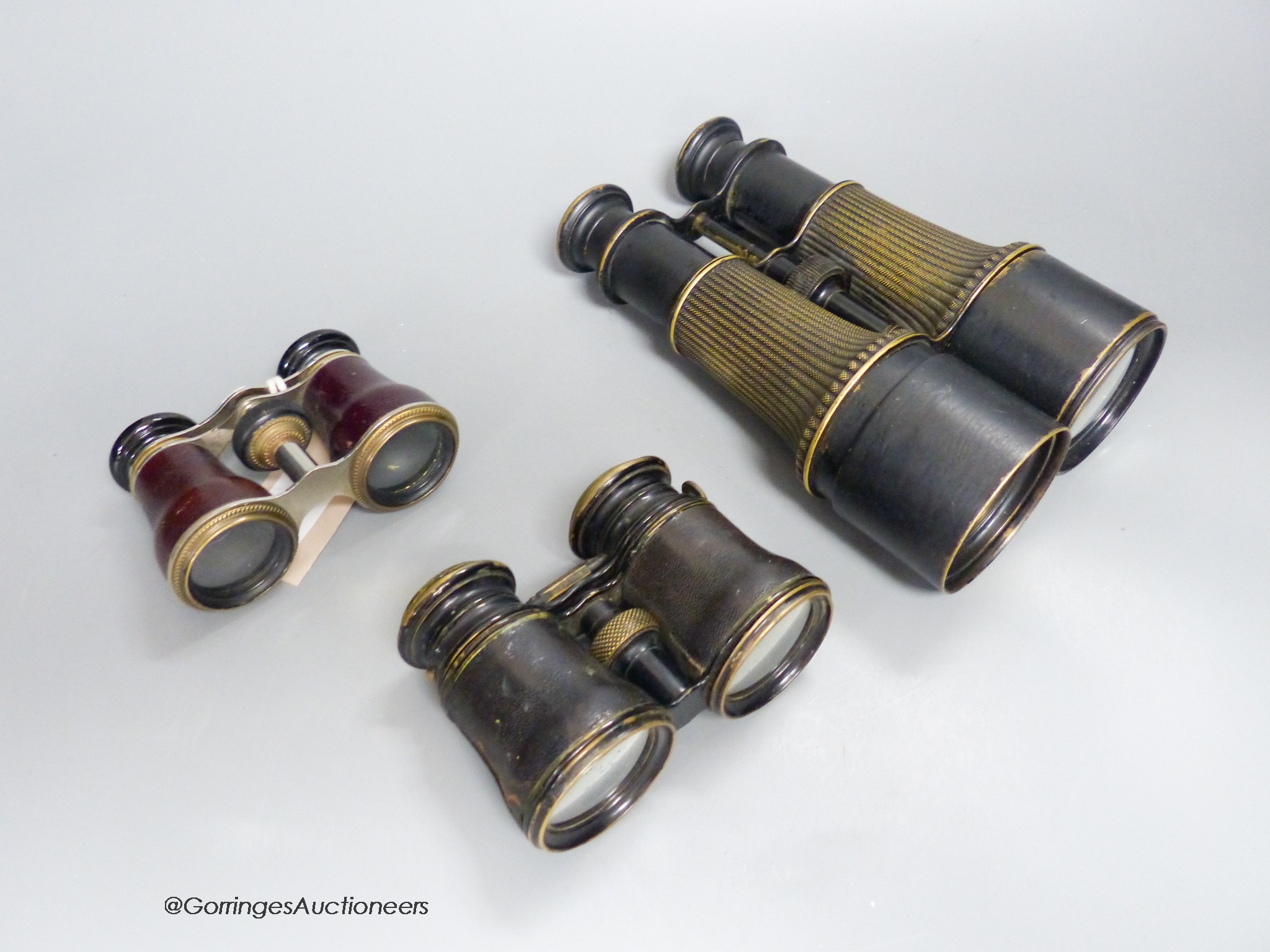 Three pairs of opera / field glasses, longest 20cm